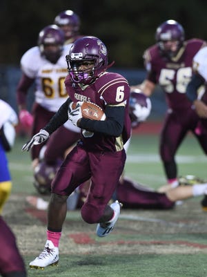 Arlington's RicardoYolas carries the ball during Friday's home game versus Mount Vernon. 