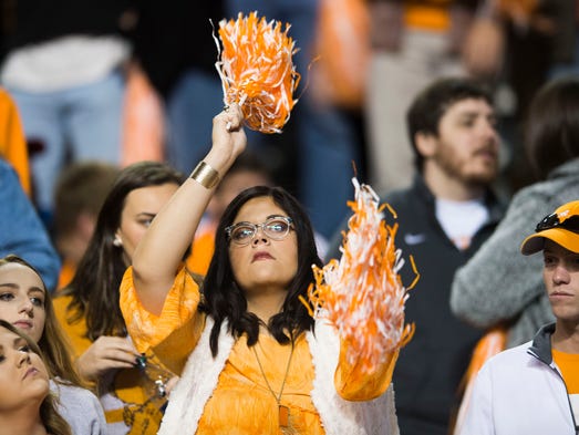 A Tennessee fan waves pom poms during a game between