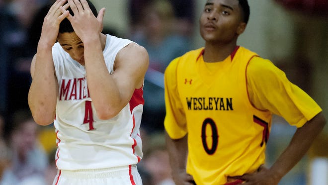 KINFAY MOROTI/THE NEWS-PRESS.. Mater Dei's La'Vette Parker, left, reacts to fouling out against Wesleyan Christian in the final minutes of their quarterfinal game Saturday (12/20/14) during the 42nd Annual Culligan City of Palms Classic at Bishop Verot High School in Fort Myers. Wesleyan Christian beat Mater Dei 67-62.