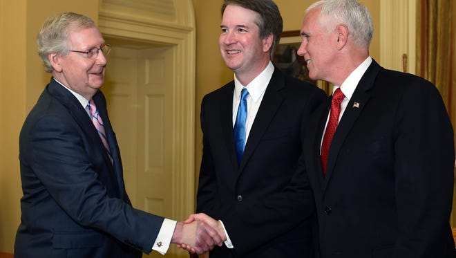 Senate Majority Leader Mitch McConnell of Ky., left, shakes hands with Vice President Mike Pence, right, in front of Supreme Court nominee Brett Kavanaugh, center, during a visit to Capitol Hill in Washington, Tuesday, July 10, 2018. Kavanaugh is on Capitol Hill to meet with Republican leaders as the battle begins over his nomination to the Supreme Court. (AP Photo/Susan Walsh)