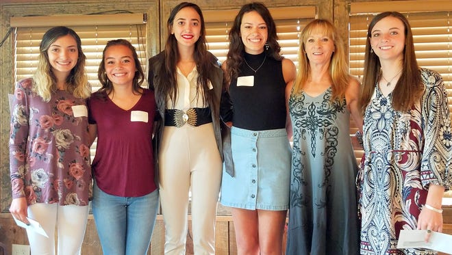 Darien Ross, chairman of the RLCAR scholarship committee, was joined for a photo by recipients from left, Naomi Chavez, Kathryn Fernandez, Jazmine Nava, Breck Gavin and Joyce Anne Cooper.