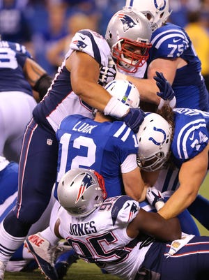 Indianapolis Colts quarterback Andrew Luck (12) is sacked in the fourth quarter action of an NFL football game Sunday, Oct. 18, 2015, at Lucas Oil Stadium.