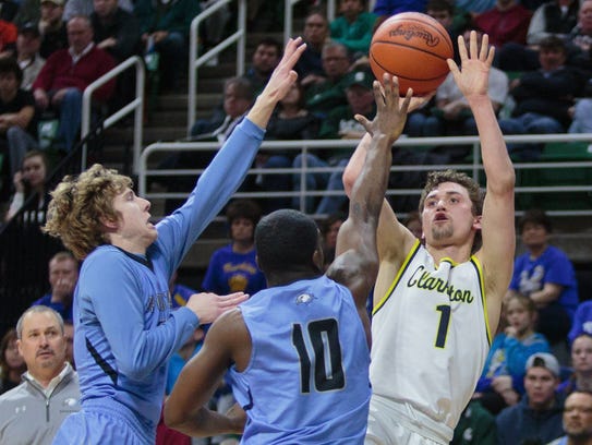 Clarkston?s Foster Loyer shoots over Grand Rapids Christian?s