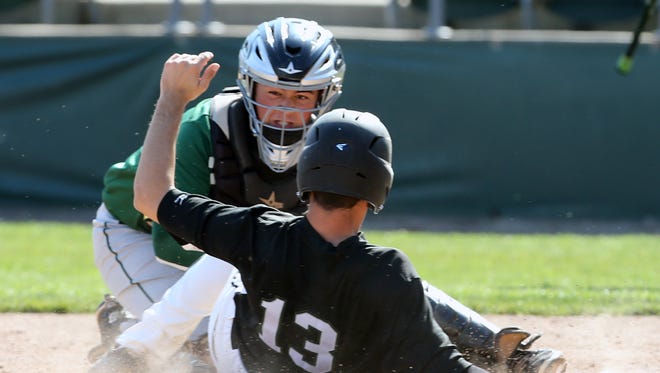Ridge vs. Montgomery in the Somerset County Tournament baseball semifinals at TD Bank Park Ball in Bridgewater on Thursday May 12, 2016.Montgomery catcher (left) Jesse Gerdes puts the tag on Ridge's # 13 Jack Peacock for the out at home plate. 