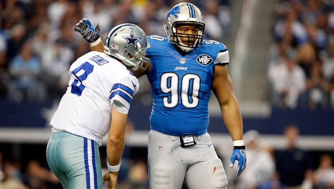 Lions defensive tackle Ndamukong Suh, right, and Tony Romo during the NFC Wild Card game on Jan 4, 2015 in Arlington.