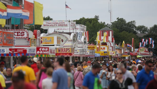 A sea of people make their way down the Grand Concourse on the second to last day of the 2015 Iowa State Fair, Saturday, August 22, 2015 in Des Moines.