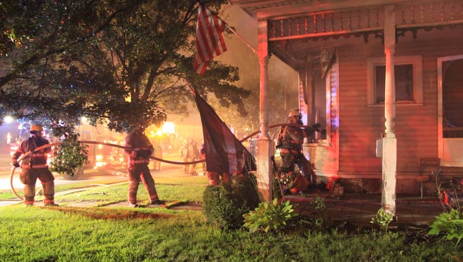Endicott firefighters respond to the Aug. 10 fire at 410 E. Main St., which prosecutors say was started by a fellow village firefighter who lived there.