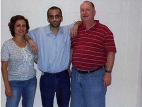 Christopher Sharikas, center, with his mother Sana