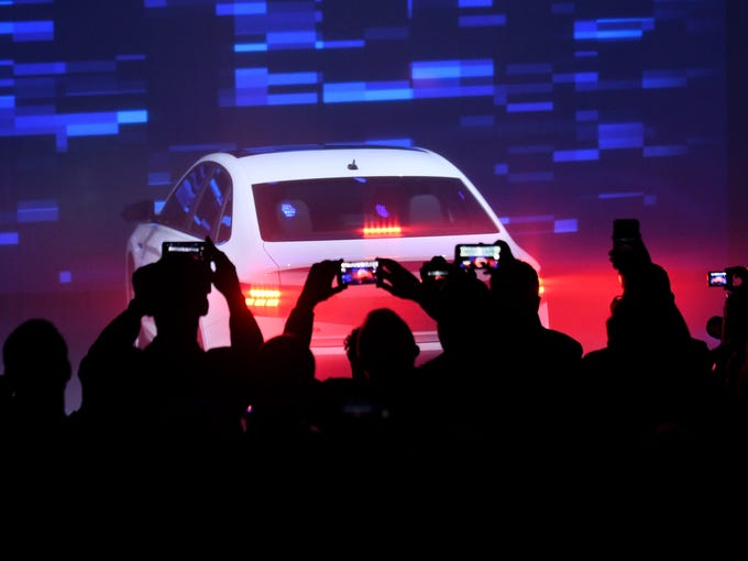 Journalists watch the introduction of the 2019 Volkswagen