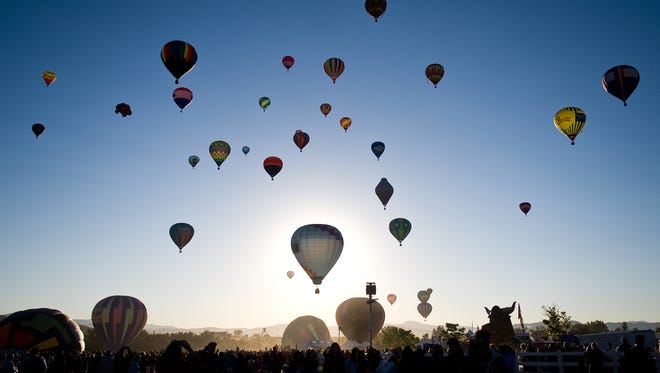 Hot air balloons take over the Reno skyline during mass ascension at the Great Reno Balloon Race.