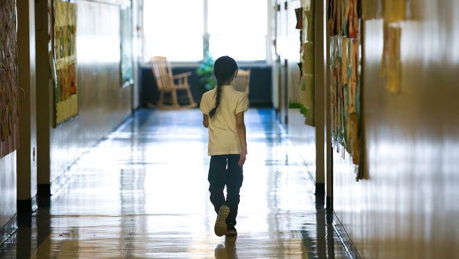 A student walks down the hallway of Casimir Pulaski Elementary School in Wilmington. Across the board, Delaware students performed slightly better in the second year of a more difficult state test.