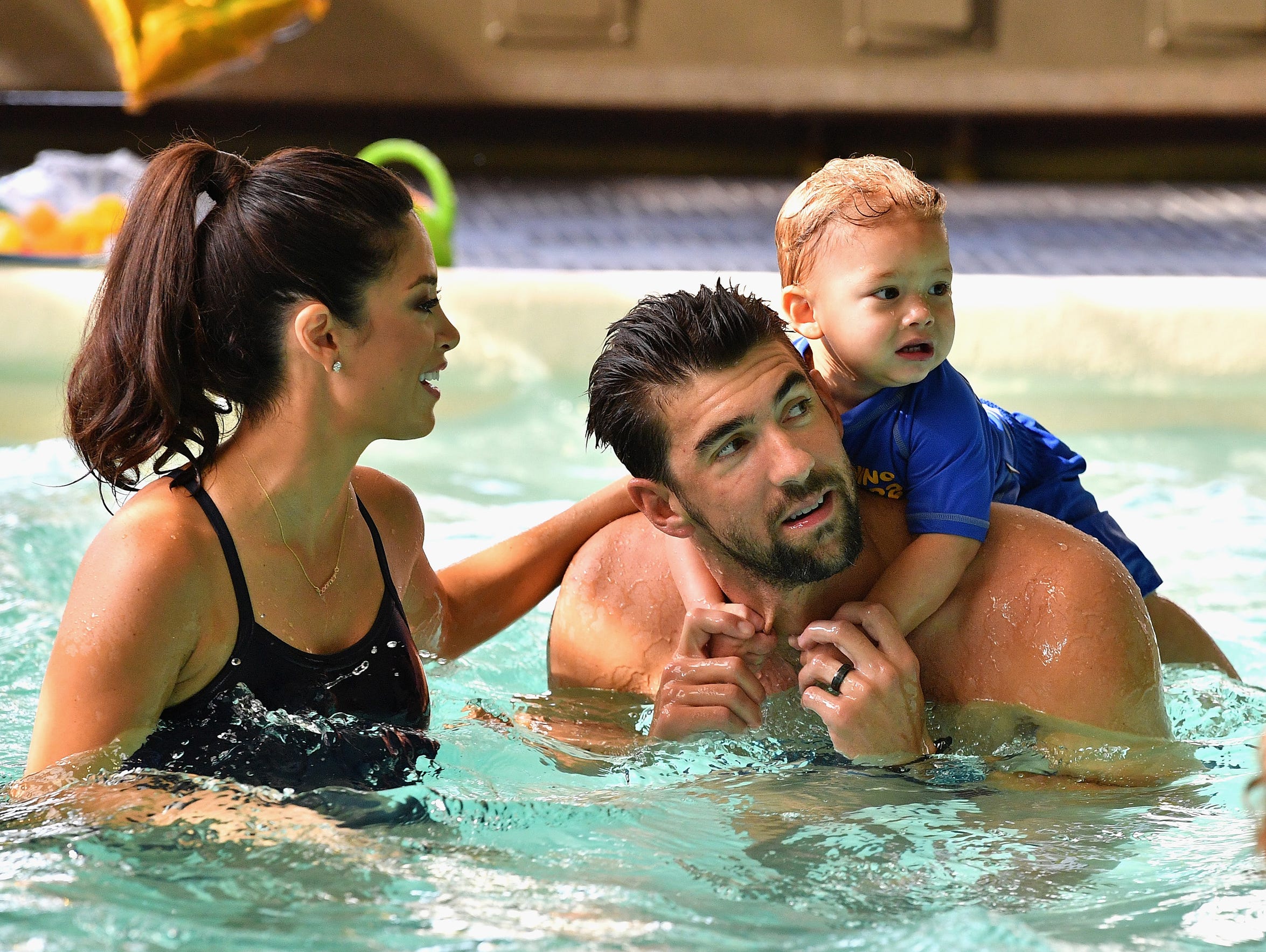 Michael Phelps, shown here with his wife Nicole and