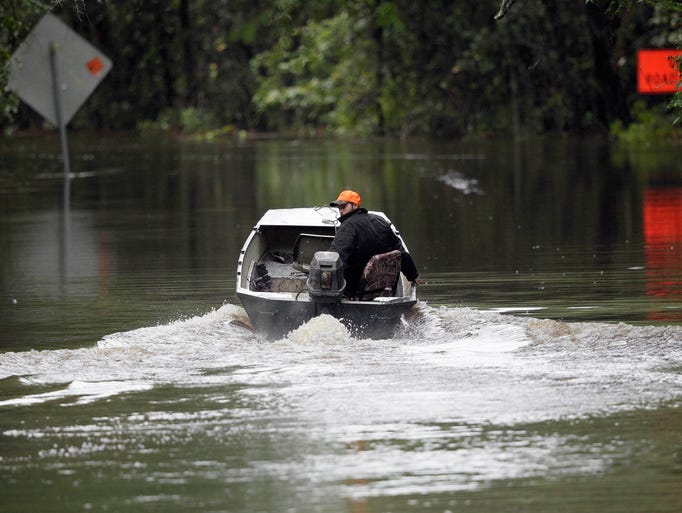 Hunter Baker motors down a flooded East Black Creek