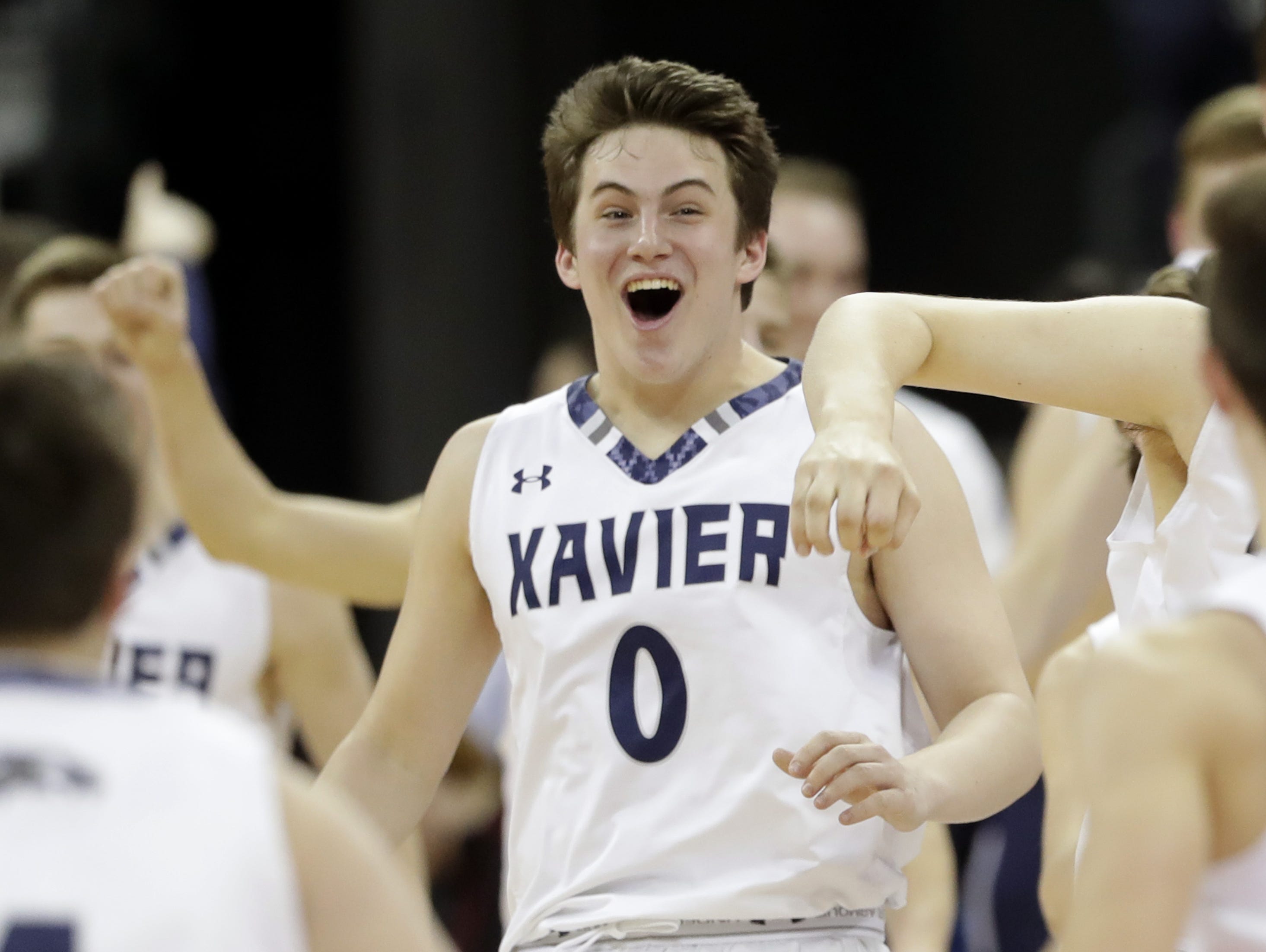 Xavier High School's Henry Egan celebrates following the Hawks' 73 to 47 victory over Prescott High School during their division 3 WIAA state basketball championship game on Saturday, March 18, 2017 at the Kohl Center in Madison, Wis. Wm. Glasheen/USA TODAY NETWORK-Wisconsin