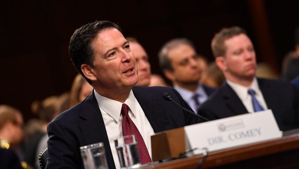Former FBI Director James Comey testifies in...