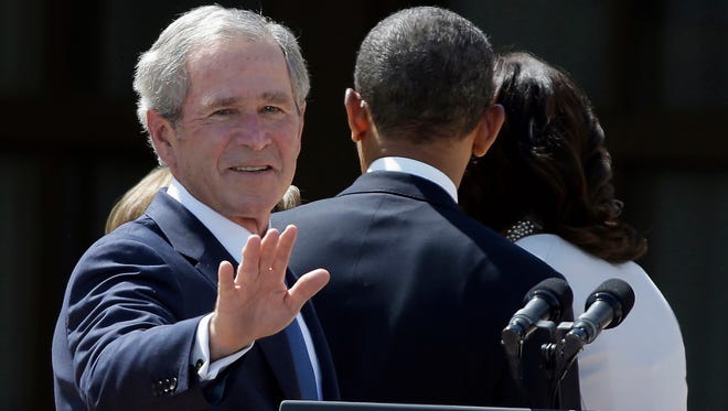 Former president George W. Bush and President Obama.