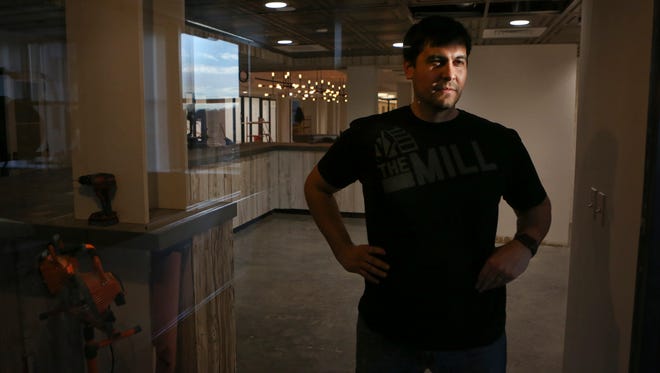 Robert Herrera, co-founder of The Mill, is shown in the Nemours Building coworking space Wednesday in Wilmington. Coworking spaces allow startups, freelancers and consultants to pay rental fees for equipment and desk space.