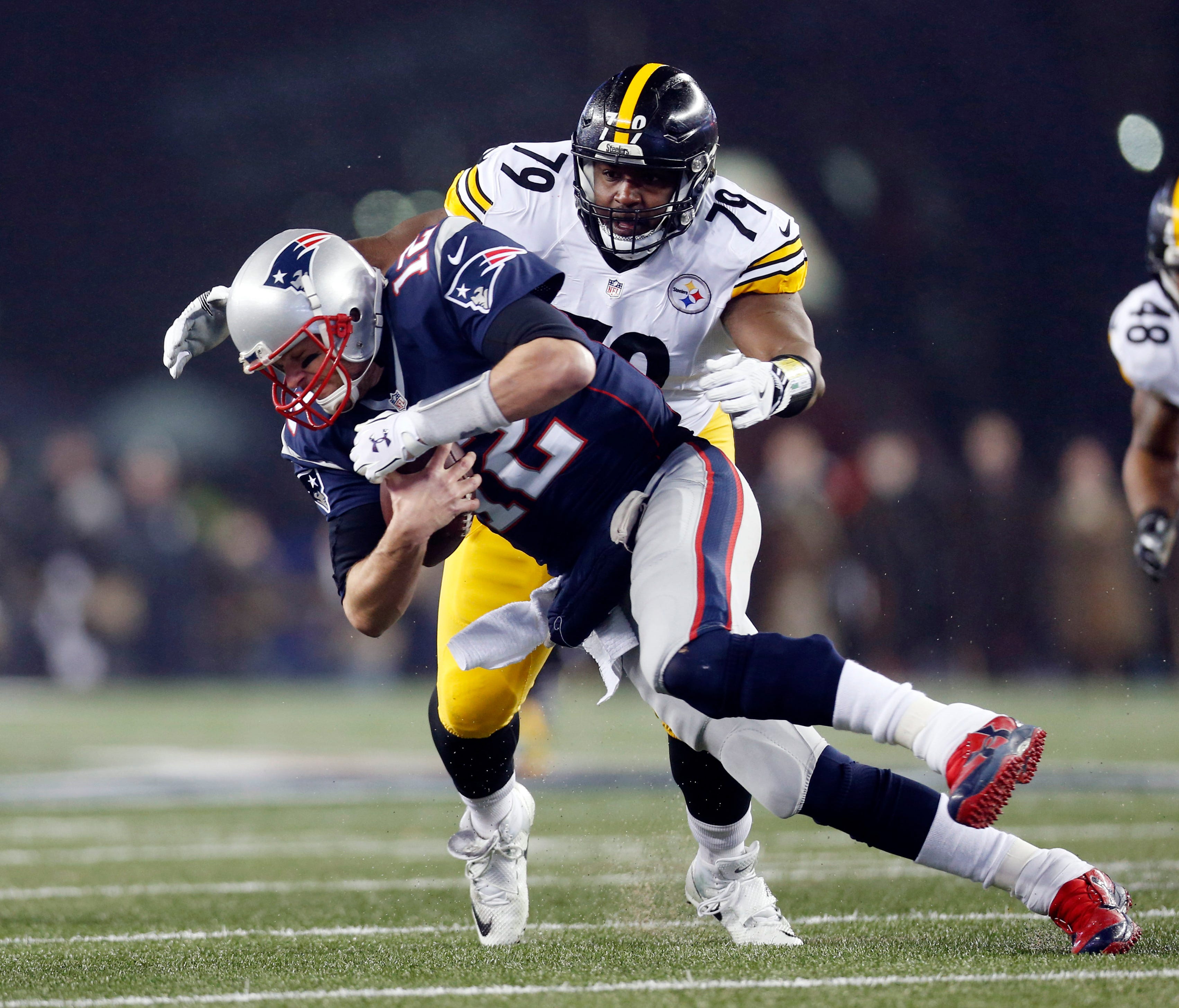 New England Patriots quarterback Tom Brady (12) is sacked by Pittsburgh Steelers nose tackle Javon Hargrave (79) in the first quarter in the 2017 AFC Championship Game at Gillette Stadium.