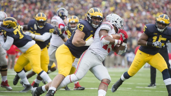 Chris Wormley, left, and the Wolverines hope to win in Columbus Saturday for the first time since 2000.