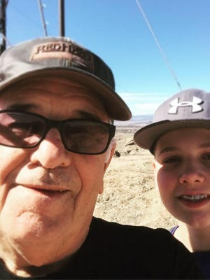 Dan Smoker Sr and his grandson, Eli, take a selfie after making it to the top of Castle Rock Trail in Colorado.