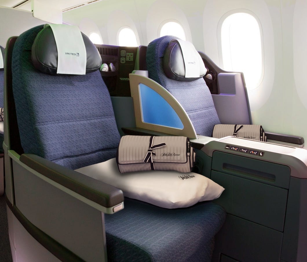 This photo provided by United shows the lie-flat seats it offers in business class on its 