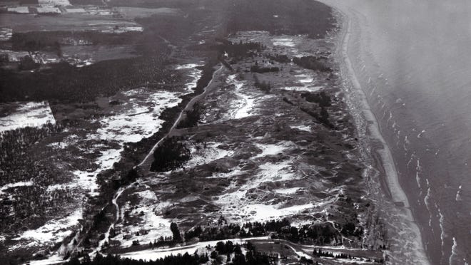 An Aerial photo from 1968 of Kohler Andrae State Park. The proposed Kohler golf course would be built in the wooded area north of the park.