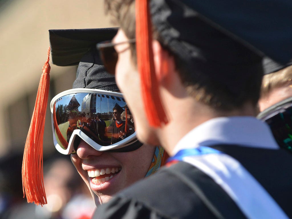 Conner Silveria wears ski goggles during the Duke University commencement,  in Durham, N.C.