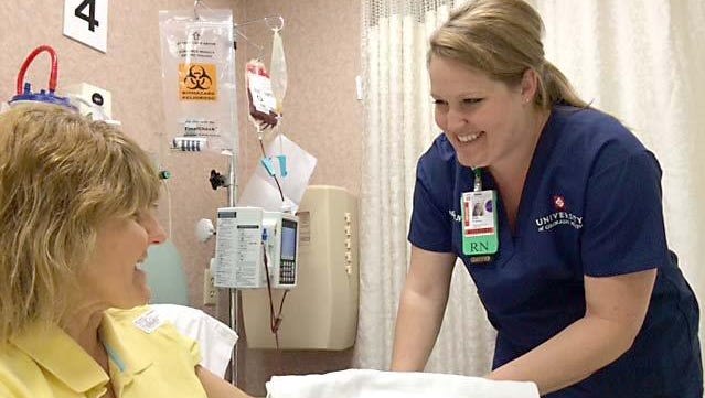 Registered nurse Bree Anderson talks with patient Sandra Conaway at Poudre Valley Hospital in Fort Collins, Colo. PVH was recognized this week as one of the nation’s 100 Top Hospitals by Truven Health Analytics.