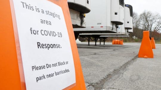 Refrigerated tractor trailers parked at James Baird State Park in LaGrange on April 20, 2020. Signs near the trailers state that they are at the park as part of a staging area for COVID-19 response.