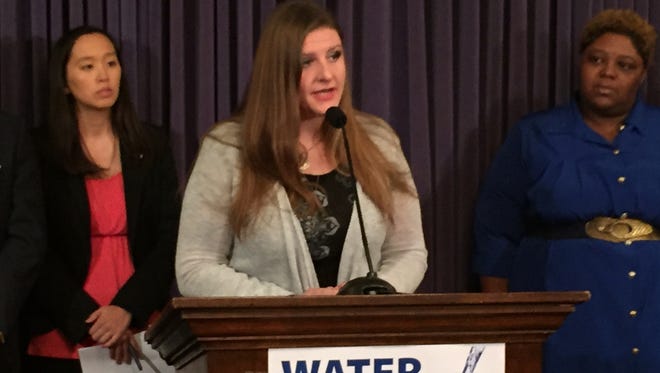 Melissa Mays, a Flint mother of three, speaks at a news conference announcing new drinking water legislation.