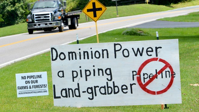 Signs opposing Dominion's proposed pipeline have been placed along U.S. 250 near Churchville.