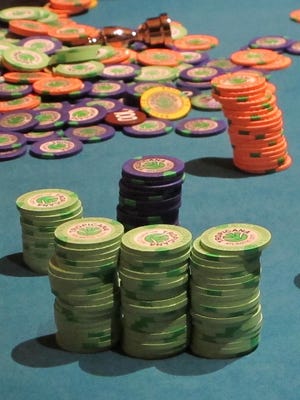 This April 17, 2015 file photo shows stacks of gambling chips on a roulette table at the Tropicana Casino and Resort in Atlantic City. On Monday, Gov. Chris Christie and legislative leaders announced an agreement on a measure to expand casino gambling to the northern part of the state.