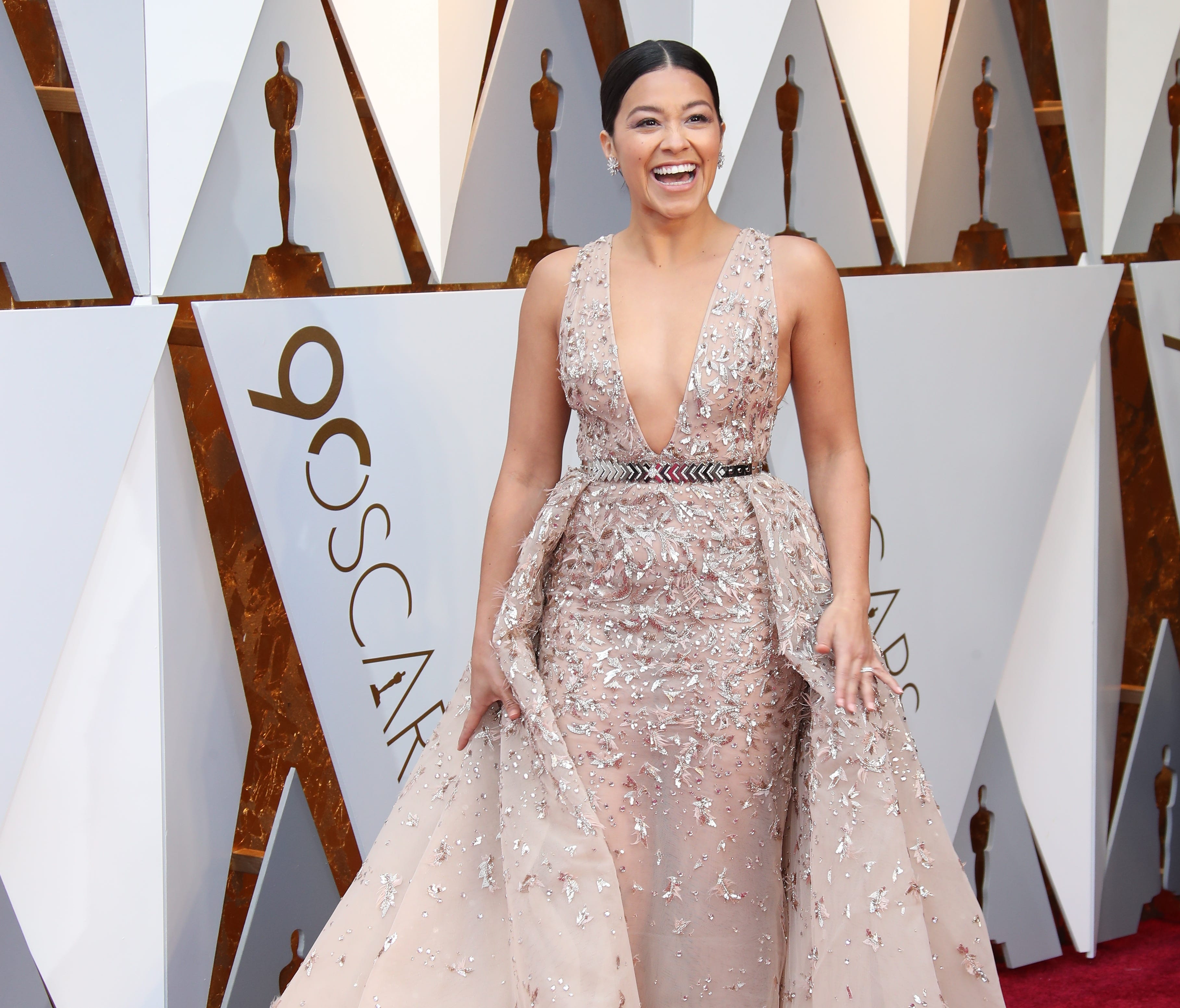 Gina Rodriguez arrives at the 90th Academy Awards.