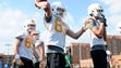 BJ Bishop (83) throws the ball back during a drill