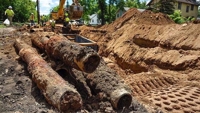 Contractors were busy replacing the main sewer and water lines Tuesday, June 28, down Fifth Avenue Southeast from Minnesota Highway 23 to Seventh Street Southeast in St. Cloud. The neighborhood project will replace main city service lines, storm drains, curbing and pavement.