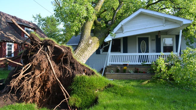 A tree fell on this house on Lakeview Avenue during the storm on May 29, 2011.