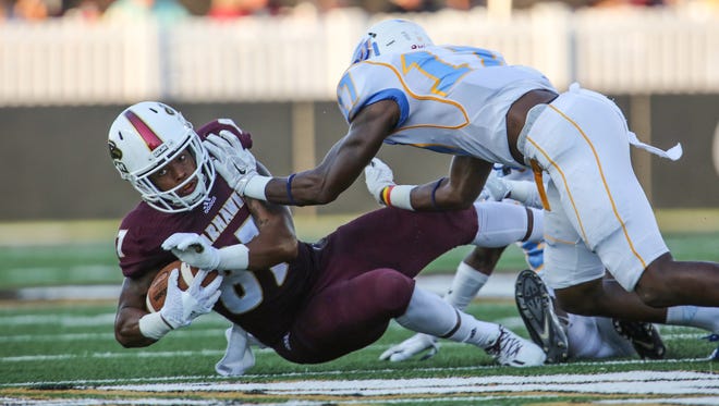ULM's Tre' Perrier (87) hauls in a pass against Southern. The Warhawks play at Oklahoma this weekend for the second time since 2013.