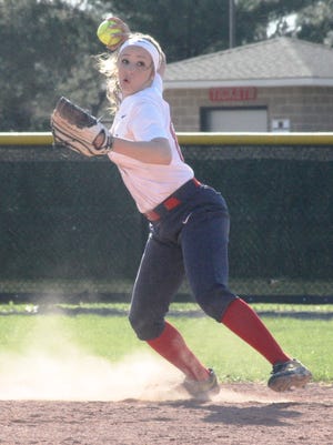 Franklin's Ashley Kent throw to first base to record the final out of the Patriots' 6-5 game-one victory.