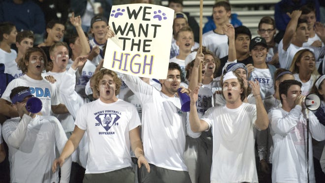 Cherry Hill West fans cheer during Friday's 28-22 overtime win over Camden. The Lions and their supporters have celebrated a rare 5-0 start.