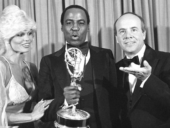Robert Guillaume, center, shows off his 1979 Emmy 