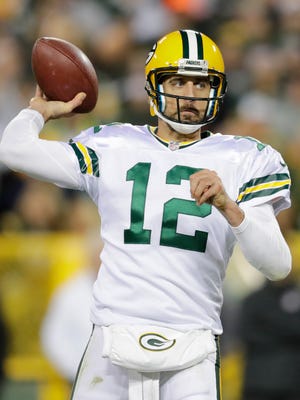 Green Bay Packers quarterback Aaron Rodgers (12) throws during the fourth quarter against the Chicago Bears at Lambeau Field.