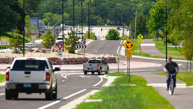 Traffic moves along the widened streets and new roundabouts Wednesday, July 5, on Second Street North/Benton County Road 3 in Sauk Rapids.