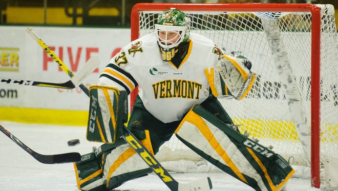 Catamount goalie Sydney SCobee (37) makes a save during the women's hockey game between the Boston Terriers and the Vermont Catamounts at Gutterson Fieldhouse on Friday night November 17, 2017 in Burlington.