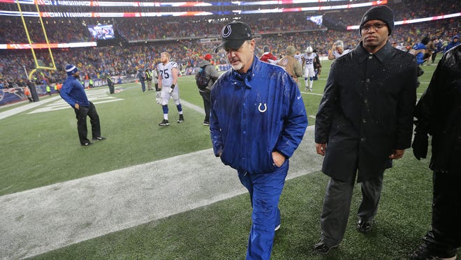 Colts head coach Chuck Pagano walks to the locker room after his team loss to the Patriots 45-7.
