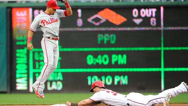Nationals right fielder Bryce Harper steals second base as Philadelphia Phillies second baseman Cesar Hernandez looks on during the first inning April 28 at Nationals Park. Harper is one of the few players in the majors who understands the pressures of going first overall in the draft.