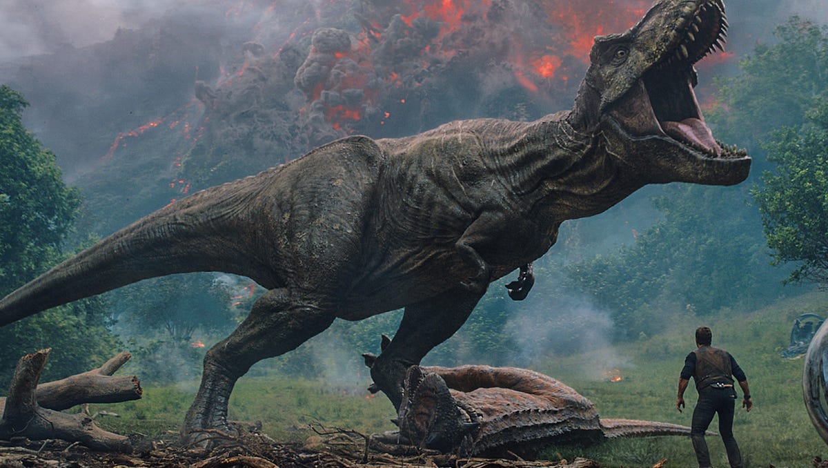 Owen (CHRIS PRATT) comes between the mighty T. rex and Claire (BRYCE  DALLAS HOWARD) and Franklin (JUSTICE SMITH) in Jurassic World: Fallen  Kingdom. When the island's dormant volcano begins roaring to life, Owen  and Claire mount a campaign to rescue the remaining dinosaurs from this  extinction-level event. Welcome to Jurassic World: Fallen Kingdom.