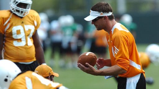 Tennessee defensive coordinator Justin Wilcox works with players during practice at Haslam Field on Aug. 7, 2010.
