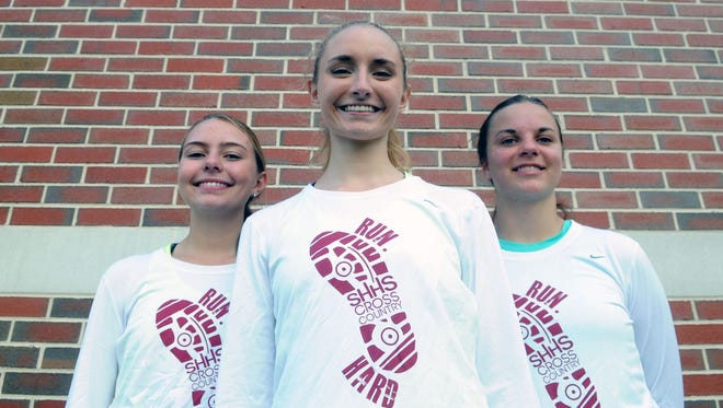 Snow Hill's top three cross country runners, Emily McAllister, left, Emily Mast and Chloe Holland are part of the reason why the Eagles have been competiting again.