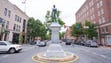 A statue of an unarmed confederate soldier stands at
