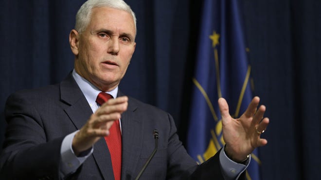 Indiana Gov. Mike Pence announces that he has signed an executive order to shorten the ISTEP+ exam to lessen the burden on students, their parents and teachers during a press conference at the Statehouse in Indianapolis, Monday, Feb. 9, 2015. (AP Photo/Michael Conroy)